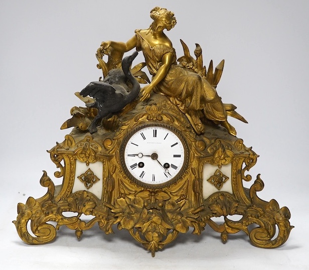 A Louis XV style gilt bronze mantel clock, 41cm wide, 35cm high. Condition - one replacement foot, fair but very dusty, not tested as working